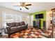 Living room with hardwood floors, a ceiling fan, and a view into the kitchen at 4163 Citizen Cir, Austell, GA 30106