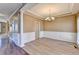 Spacious dining room with hardwood floors, chair railing, and a chandelier at 513 Mirramont Place, Woodstock, GA 30189