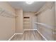 Large walk-in closet with wire shelving and neutral walls at 513 Mirramont Place, Woodstock, GA 30189