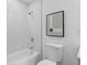 Clean bathroom with marble tile shower and white toilet at 1921 Westwood Sw Ave, Atlanta, GA 30310