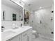 Modern bathroom with double vanity and a large walk-in shower at 1921 Westwood Sw Ave, Atlanta, GA 30310