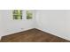 Bright bedroom with hardwood floors and large windows at 1921 Westwood Sw Ave, Atlanta, GA 30310