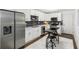Modern kitchen with white cabinets, stainless steel appliances, and quartz countertops at 1921 Westwood Sw Ave, Atlanta, GA 30310