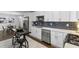 Modern kitchen features stainless steel appliances and white cabinets at 1921 Westwood Sw Ave, Atlanta, GA 30310