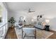 Spacious living room featuring hardwood floors, a cozy seating area, and abundant natural light at 1921 Westwood Sw Ave, Atlanta, GA 30310