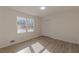 Well-lit bedroom with wood-look floors and closet at 1990 Old Concord Se Dr, Covington, GA 30016