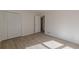 Bedroom with wood-look floors and large closet at 1990 Old Concord Se Dr, Covington, GA 30016