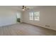 Bedroom with ceiling fan, wood floors, and en-suite bath at 1990 Old Concord Se Dr, Covington, GA 30016