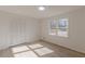 Bright bedroom with wood-look floors and large closet at 1990 Old Concord Se Dr, Covington, GA 30016