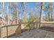 Deck with view of fenced backyard and trees at 1990 Old Concord Se Dr, Covington, GA 30016
