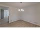 Bright dining room with light flooring and chandelier at 1990 Old Concord Se Dr, Covington, GA 30016