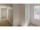 Light-filled hallway with doors to other rooms at 1990 Old Concord Se Dr, Covington, GA 30016