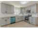 Modern gray kitchen with stainless steel appliances and granite countertops at 1990 Old Concord Se Dr, Covington, GA 30016