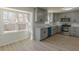 Modern kitchen with gray cabinets,granite counters & stainless steel appliances at 1990 Old Concord Se Dr, Covington, GA 30016