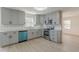 Modern gray kitchen with stainless steel appliances and granite countertops at 1990 Old Concord Se Dr, Covington, GA 30016
