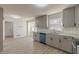 Modern gray kitchen with stainless steel appliances and granite countertops at 1990 Old Concord Se Dr, Covington, GA 30016