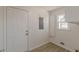 Bright laundry room with new flooring and white cabinetry at 1990 Old Concord Se Dr, Covington, GA 30016