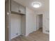 Laundry room with new flooring and built-in shelving at 1990 Old Concord Se Dr, Covington, GA 30016