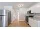 Modern kitchen with stainless steel appliances and white cabinets at 2422 Napa Valley Dr, Villa Rica, GA 30180