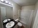 Clean bathroom with single vanity, tub shower combo, and updated fixtures at 3325 Royal Springs Ct, Decatur, GA 30034