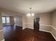 Dining room with dark hardwood floors, neutral walls, and views into adjacent rooms at 3325 Royal Springs Ct, Decatur, GA 30034