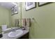 Small bathroom boasts a granite countertop and updated sink and fixtures at 4089 Palm Dr, Snellville, GA 30039