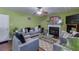 Bright living room with hardwood floors, fireplace, and gray sofas at 4089 Palm Dr, Snellville, GA 30039