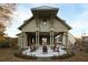 Well-appointed exterior of a modern barn-style home with a covered patio, comfortable seating, and landscaped grounds at 84 Black Gum Ln # 44, Auburn, GA 30011