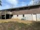 Back exterior view of the home showing the siding, basement and outdoor deck at 1473 Brownleaf Dr, Jonesboro, GA 30236