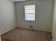 Basic bedroom with carpet flooring, neutral walls, and a window with blinds at 1473 Brownleaf Dr, Jonesboro, GA 30236