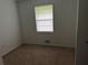 Small bedroom with carpet and window blinds at 1473 Brownleaf Dr, Jonesboro, GA 30236