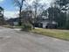 Street view of a cozy home with a well-kept lawn and surrounding trees at 1473 Brownleaf Dr, Jonesboro, GA 30236