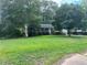 Brick ranch home with a spacious yard and driveway at 1473 Brownleaf Dr, Jonesboro, GA 30236