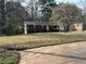 Inviting single-story home with brick accents, complemented by a lush front yard landscape at 1473 Brownleaf Dr, Jonesboro, GA 30236
