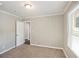 Cozy bedroom with neutral walls and wall-to-wall carpeting at 2077 Rosewood Rd, Decatur, GA 30032
