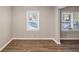 Bright dining room with hardwood floors and large windows at 2077 Rosewood Rd, Decatur, GA 30032