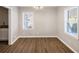 Dining area with wood-look floors and neutral walls at 2077 Rosewood Rd, Decatur, GA 30032