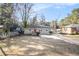 Front yard view of charming ranch home with landscaping at 2077 Rosewood Rd, Decatur, GA 30032