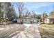 Ranch style home with a stone pathway and mature trees at 2077 Rosewood Rd, Decatur, GA 30032