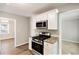 Updated kitchen, featuring granite countertops and white cabinets at 2077 Rosewood Rd, Decatur, GA 30032