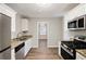 Renovated kitchen with stainless steel appliances and granite counters at 2077 Rosewood Rd, Decatur, GA 30032