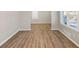 Bright living room featuring wood-look floors and neutral walls at 2077 Rosewood Rd, Decatur, GA 30032