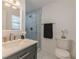 Bathroom vanity with a large mirror and glass shower at 2649 Santa Barbara Nw Dr, Atlanta, GA 30318