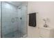 Updated bathroom with a glass shower and a modern gray vanity at 2649 Santa Barbara Nw Dr, Atlanta, GA 30318