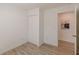 A simple bedroom features a closet and doorway to another room at 2649 Santa Barbara Nw Dr, Atlanta, GA 30318