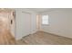 Bedroom with wood-look floors, closet, and a window at 2649 Santa Barbara Nw Dr, Atlanta, GA 30318