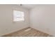 Cozy bedroom with wood-look flooring has a window providing natural light at 2649 Santa Barbara Nw Dr, Atlanta, GA 30318