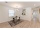 Bright dining area with a modern table setting, decorative rug, and a stylish chandelier at 2649 Santa Barbara Nw Dr, Atlanta, GA 30318