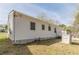 Side view showcasing the exterior of the home with white siding and yard at 2649 Santa Barbara Nw Dr, Atlanta, GA 30318
