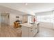 Open-concept kitchen features a central island that connects to the living area, enhancing the home's social space at 2649 Santa Barbara Nw Dr, Atlanta, GA 30318